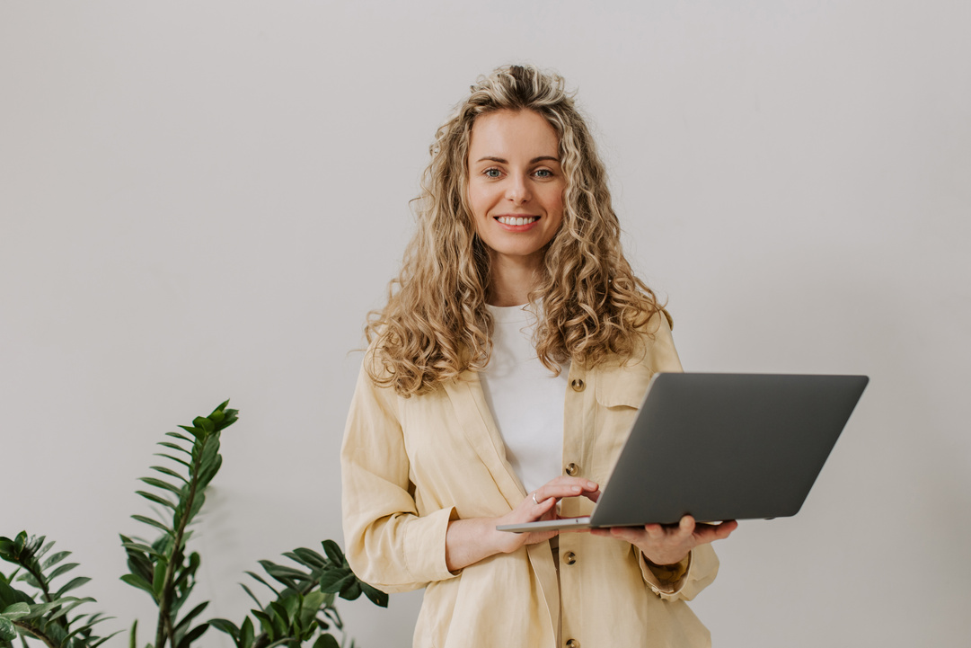 Updated Classics Headshots Woman Holding a Laptop