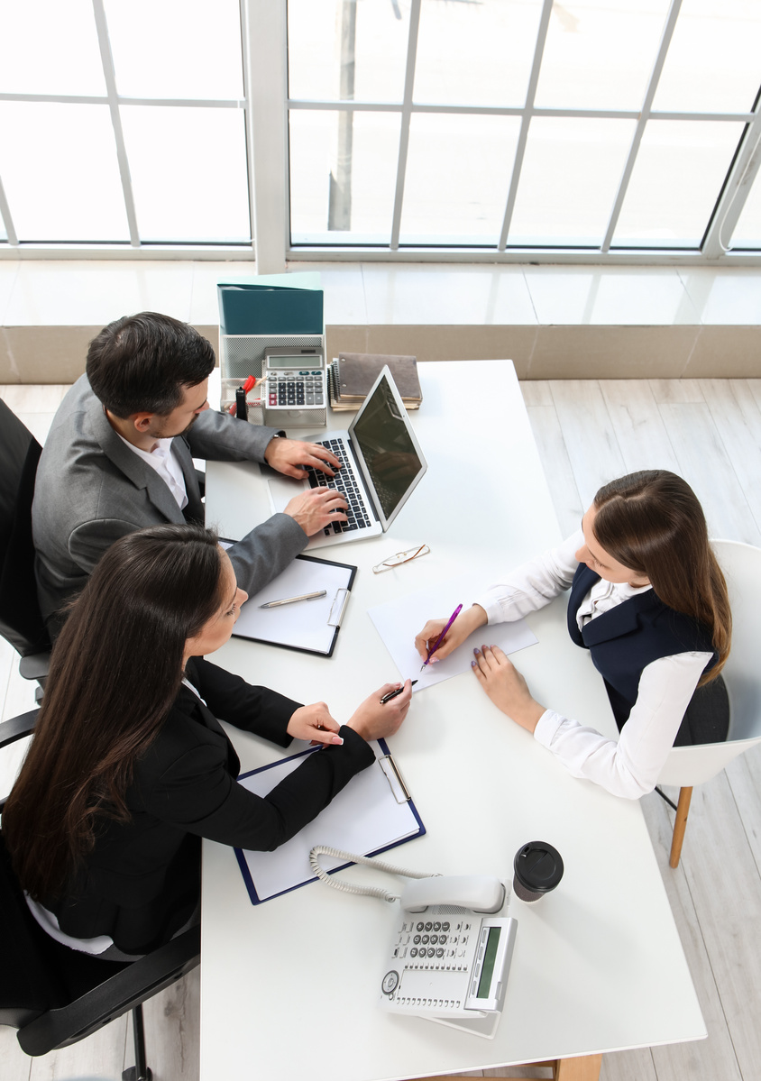 Human Resources Commission Interviewing Female Applicant in Office